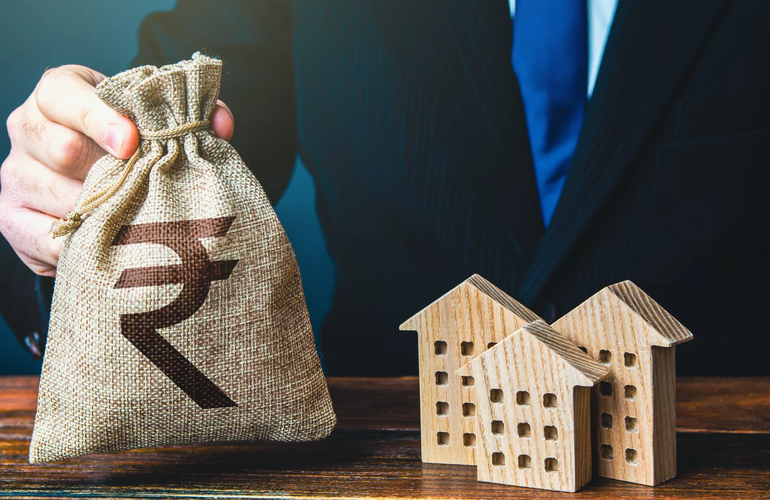 NRI GIFT City PMS Opportunities: Unlocking Wealth Creation in India's Global Financial Hub 2 indian rupee money bags residential buildings figures taxes bank offer mortgage loan scaled